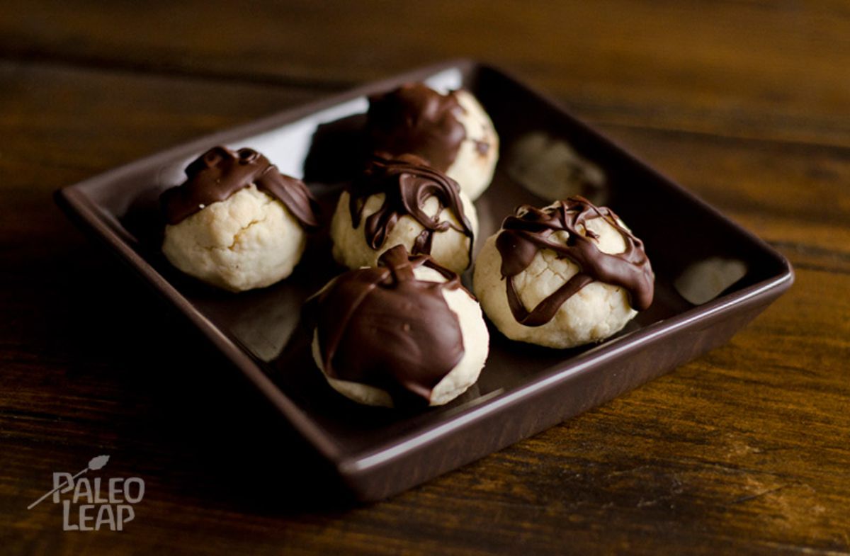 Paleo Dark Chocolate-Drizzled Shortbreads in a brown bowl.