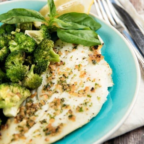 Broiled Halibut with Broccoli and Toasted Garlic on a blue plate.