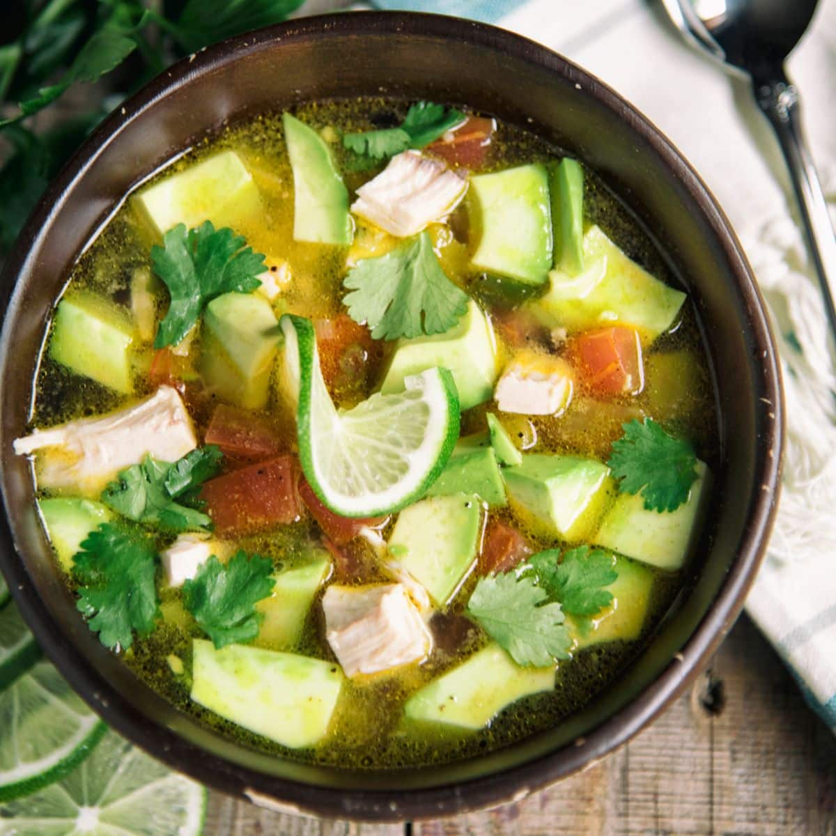 Chicken And Avocado Soup in a brown pot.