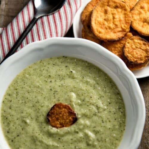 Zucchini Soup with Sweet Potato Scoops in a white bowl.