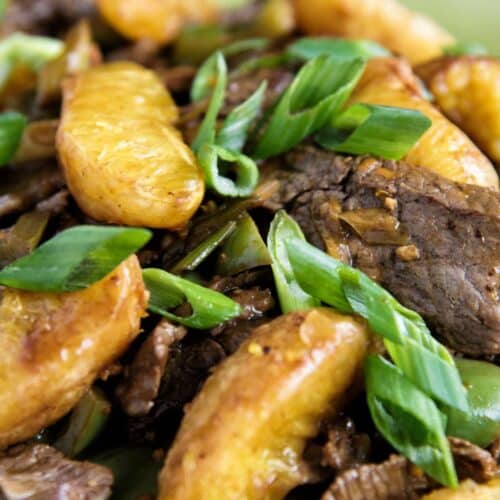 Orange and Beef Stir-Fry on a green plate.
