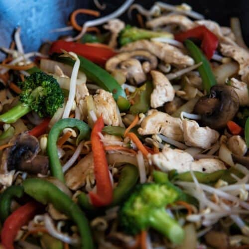 Chicken And Vegetable Stir-Fry in a black pan.