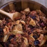 Old-Fashioned Cabbage Roll Skillet in a wooden bowl with a wooden spatula.