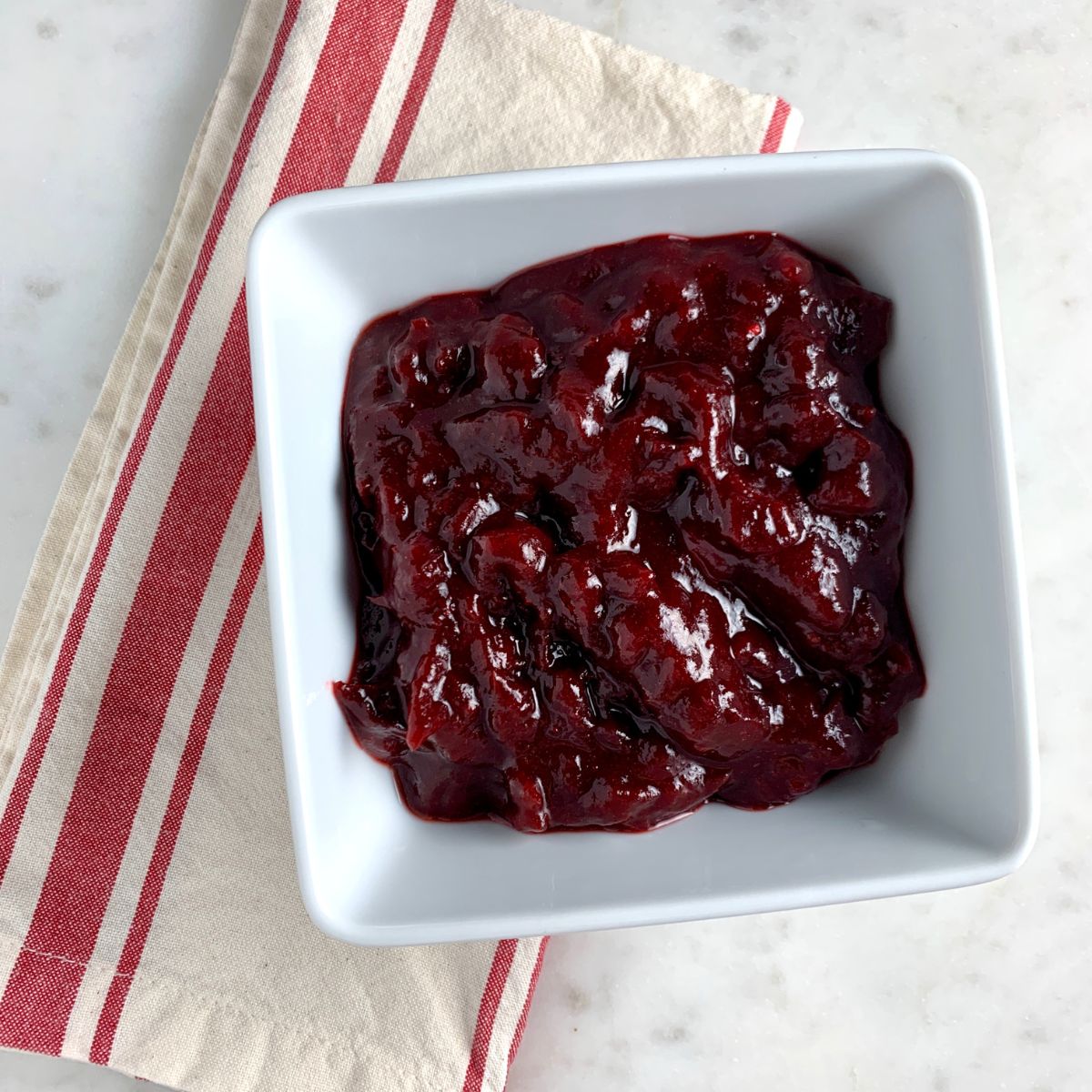 Paleo Cranberry Sauce in a white bowl.