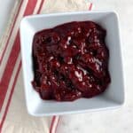 Paleo Cranberry Sauce in a white bowl.