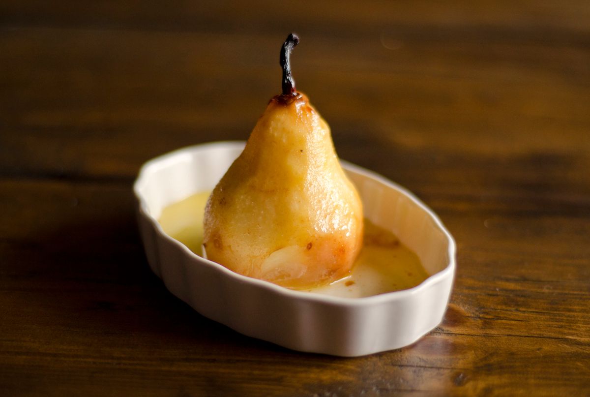 baked pear in a tiny ceramic dish