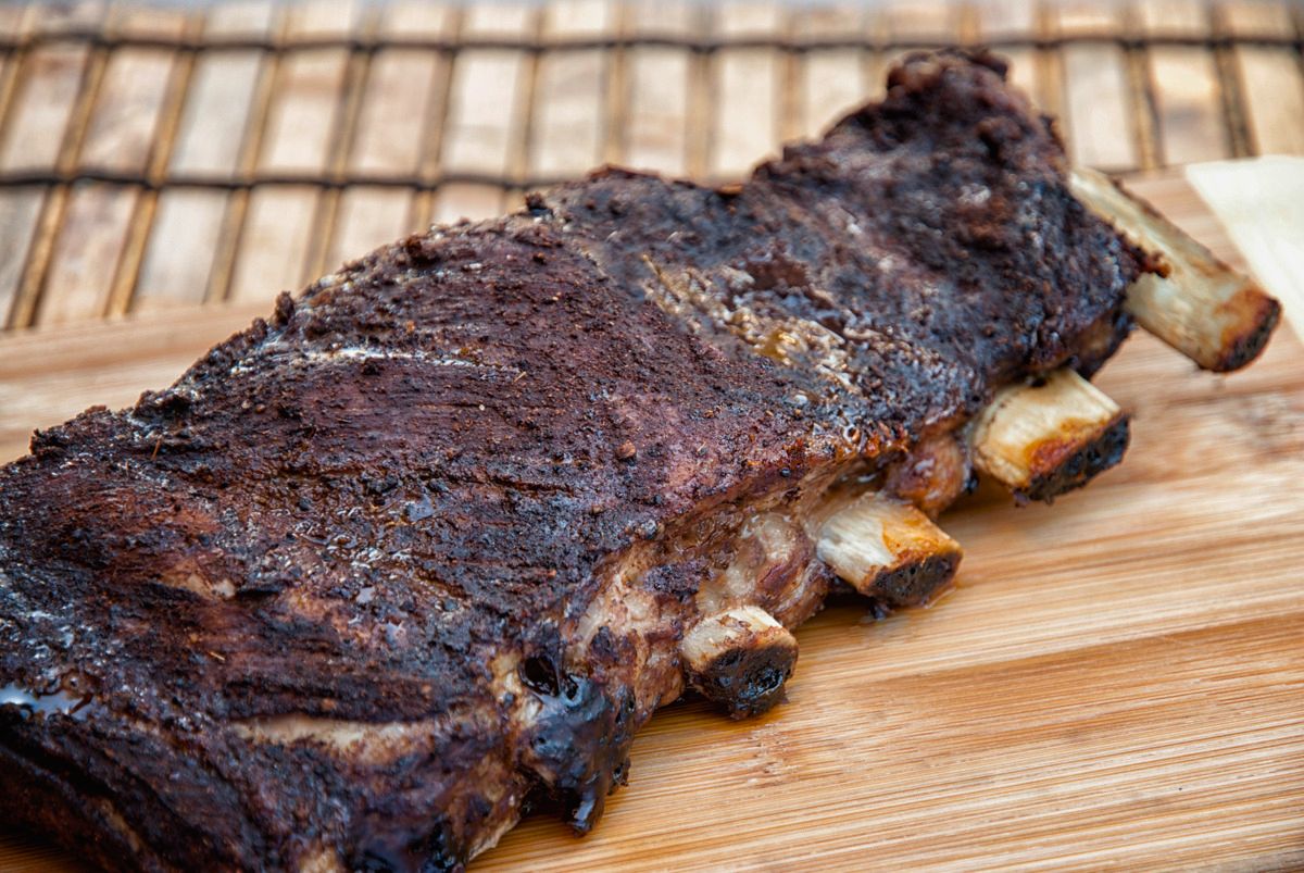 slab of baby back ribs on wooden cutting board