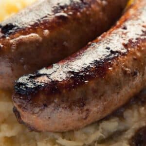 plate holding paleo sausage with parsnip mash
