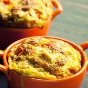 two orange baking dishes filled with Chicken and egg pie