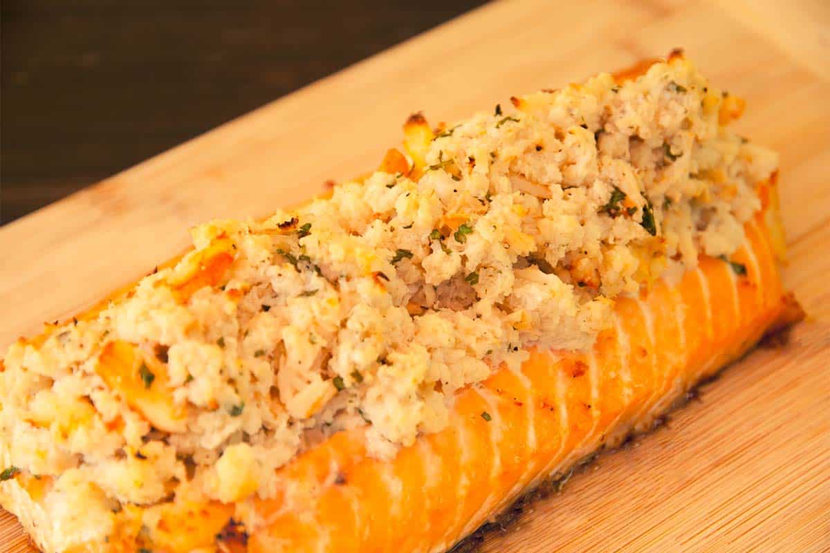 salmon with crab stuffing on a cutting board