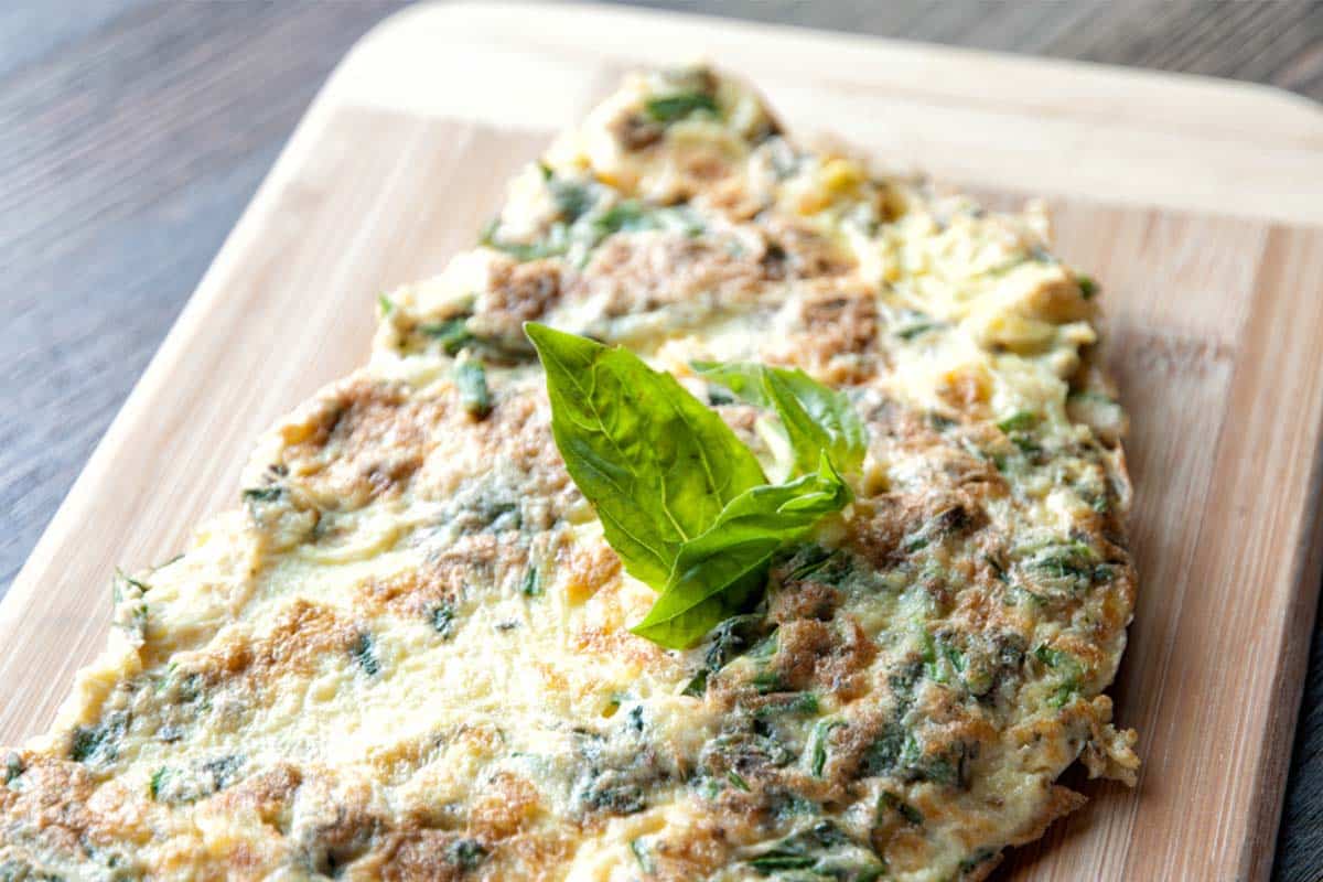 wood cutting board with a Fresh herb omelet