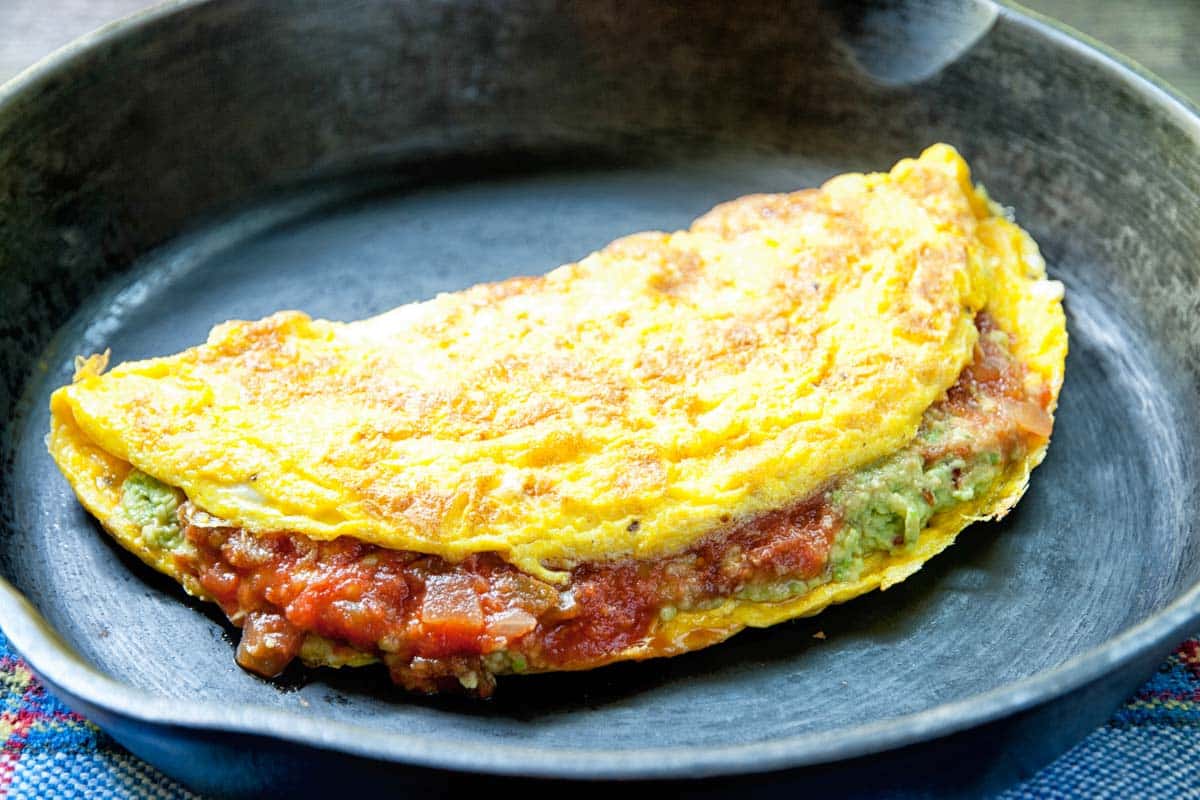 closeup of salsa and guacamole omelet