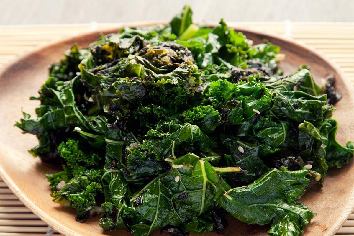 Kale and Seaweed Hot Salad piled onto a plate on a table