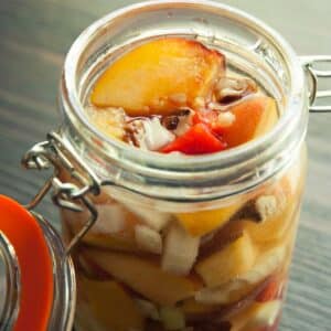 open jar of Lacto-Fermented Peach Chutney on a table