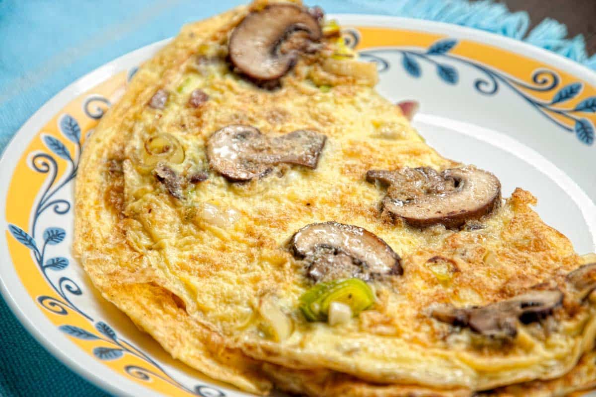 Mushroom and Leek Omelet served on a decorative plate