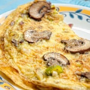 closeup of a decorative plate filled with Mushroom and Leek Omelet