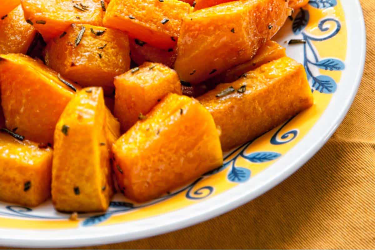 closeup of a plate with Rosemary and Balsamic Vinegar Roasted Butternut Squash on a table