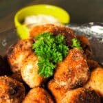 paleo-friendly Seafood Balls on a plate with sauce