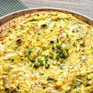 closeup of a pan filled with Zucchini quiche