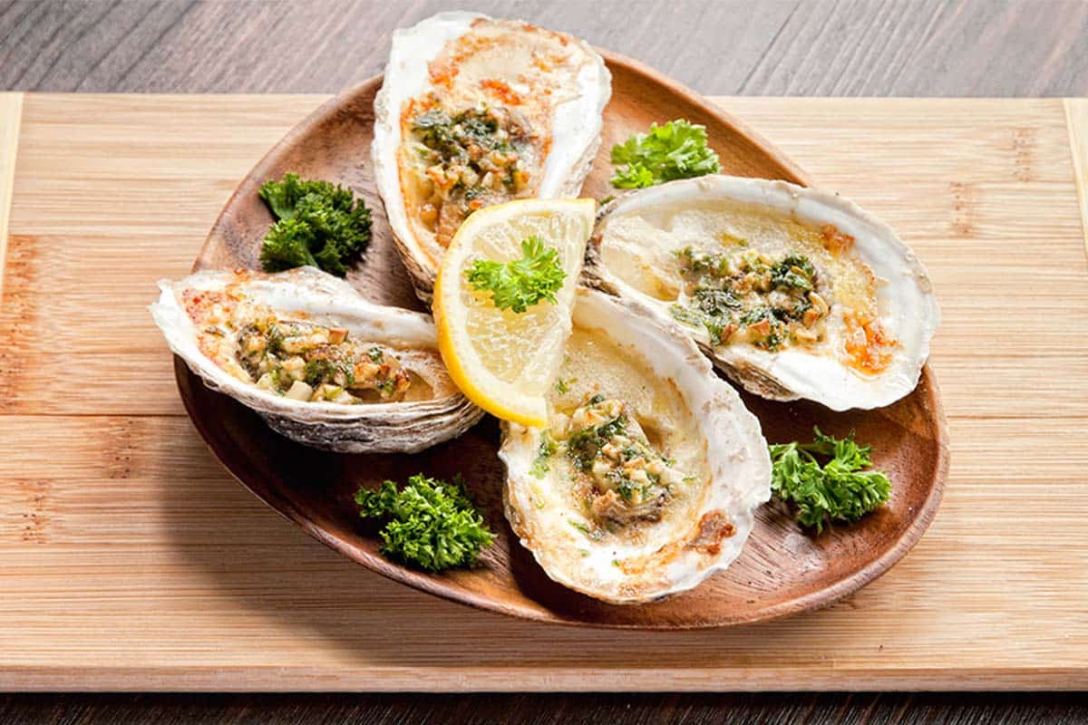 plate full of baked garlic oysters