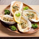 plate of paleo baked oysters with garlic