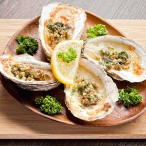 plate of paleo baked oysters with garlic