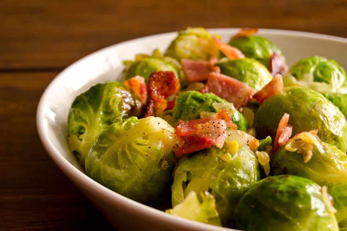 white bowl filled with brussels sprouts and bacon medley