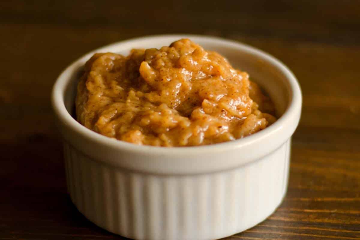 Almond butter dip in a small ramekin on a wood table