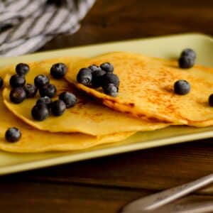 rectangular plate filled with Almond flour pancakes and blueberries on a plate