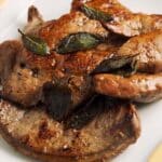 closeup of a serving of Calf’s Liver with Lime and Sage on a white plate