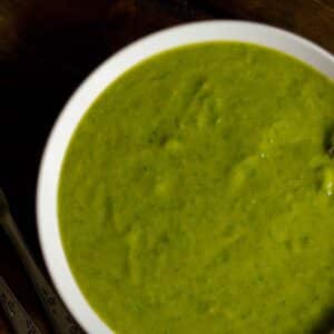 white bowl filled with Green spinach and chard soup