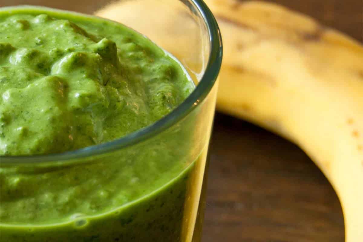 closeup of Kale and banana green smoothie in a glass