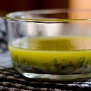 Lime and honey steak marinade in a glass bowl on a table