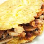 closeup of Mexican Chicken Omelet on a white plate