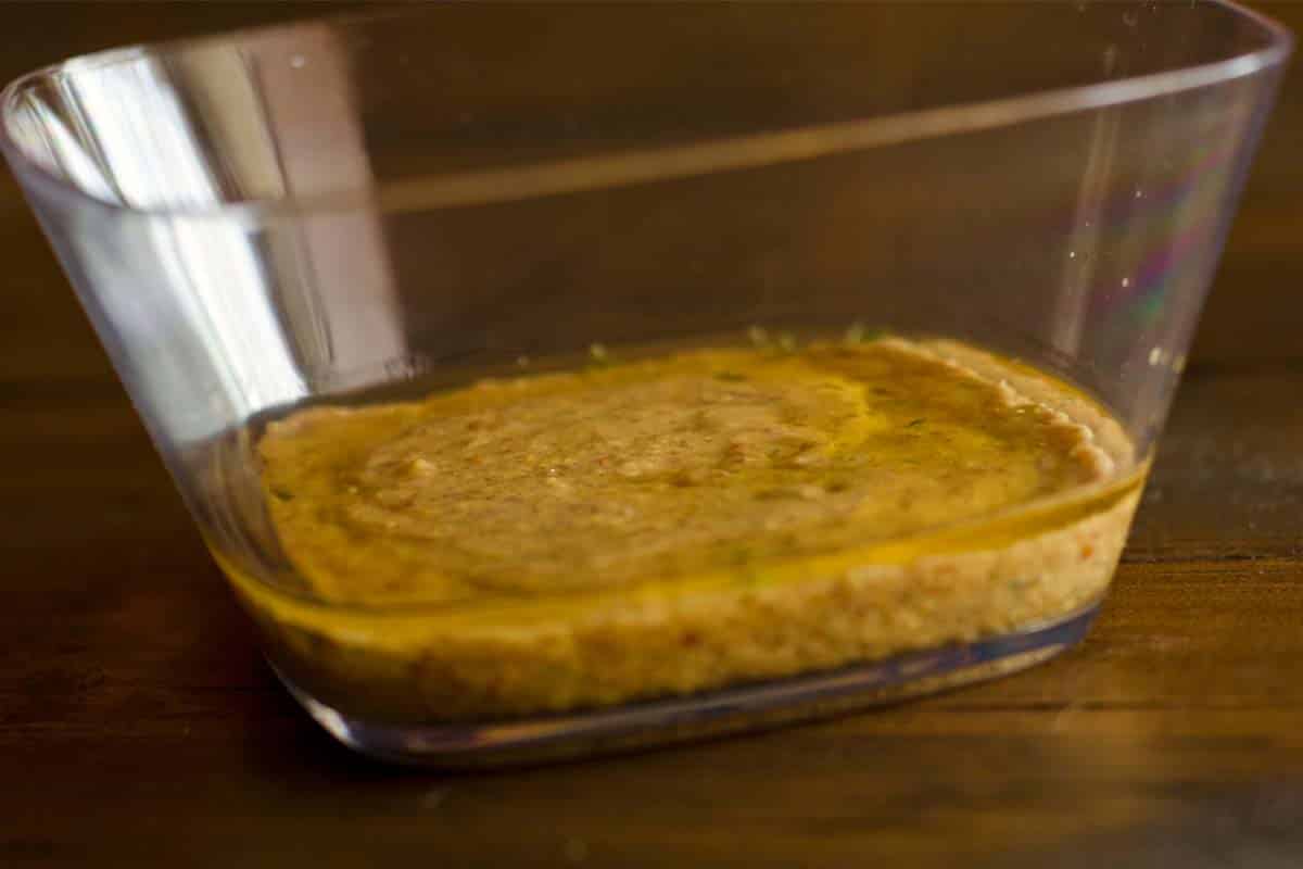 sideview of a glass bowl of Mustard marinade