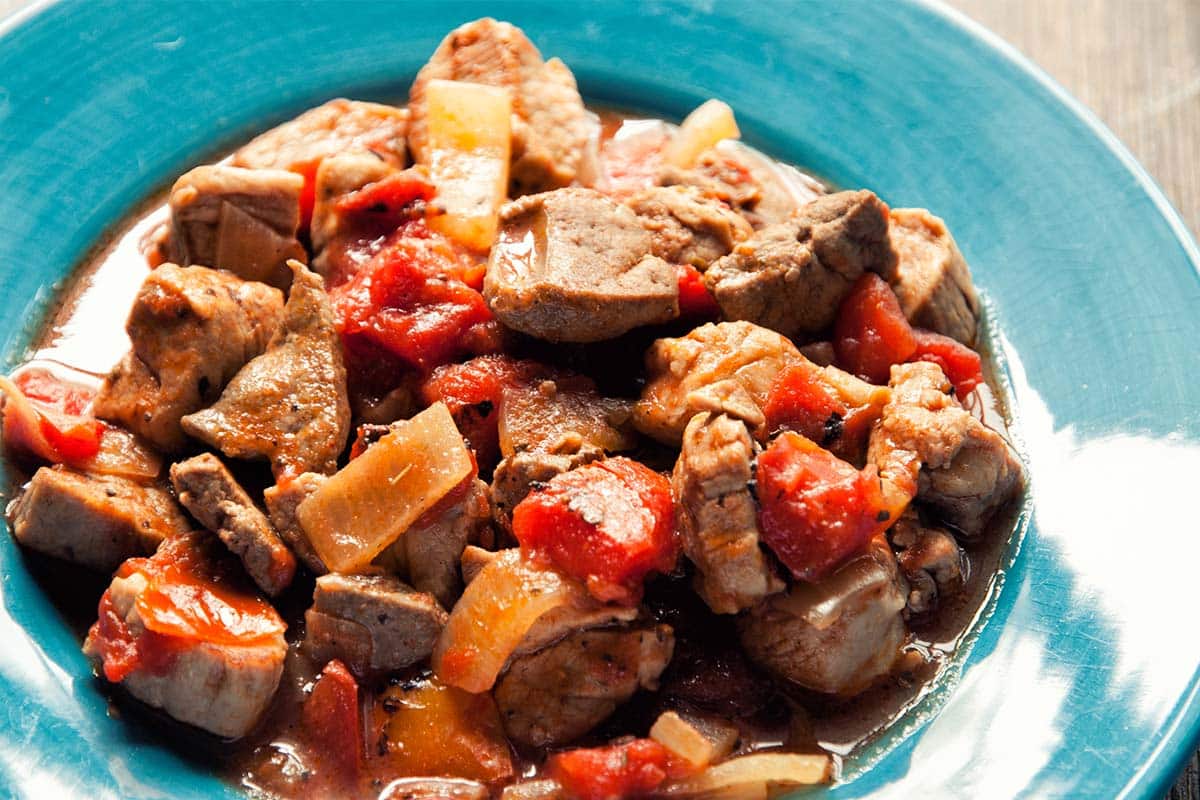 closeup of Pork and lamb kidney hot pot on a blue plate