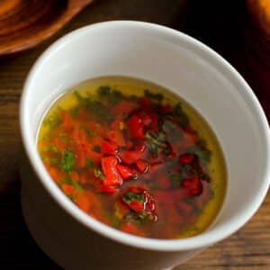 overhead view of a white ramekin full of Roasted chilli dressing