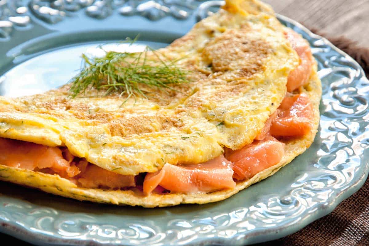 closeup of Smoked Salmon Omelet on a light blue plate