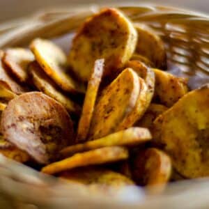 closeup of a basket full of Spicy plantain chips