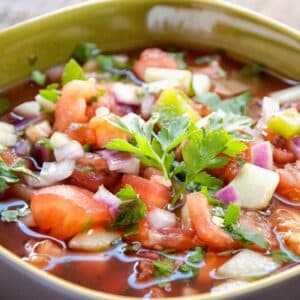 closeup of serving of Vegetable gazpacho in a square bowl