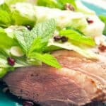 duck breast slices with pomegranate salad